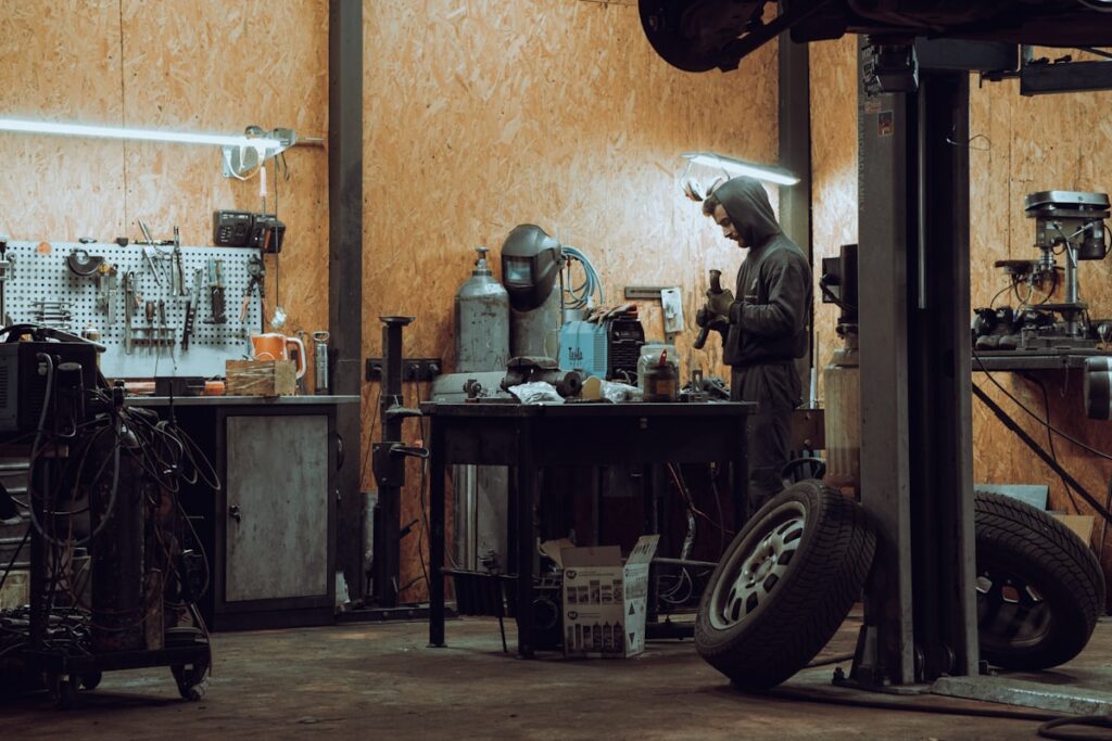 Man working on a machine in a garage