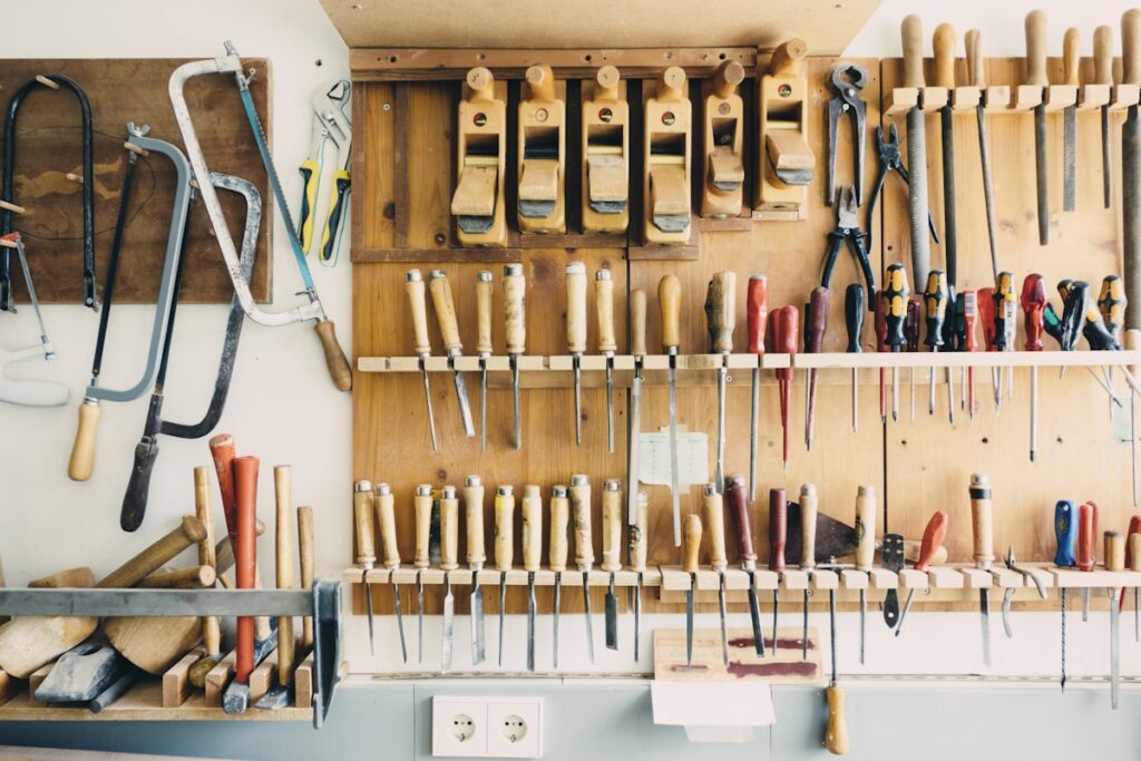 Assorted handheld tools in a tool rack