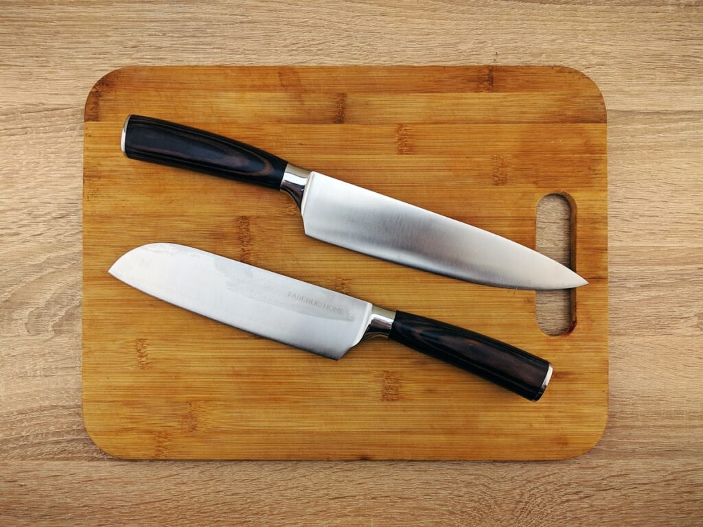 A set of kitchen knives on a cutting board