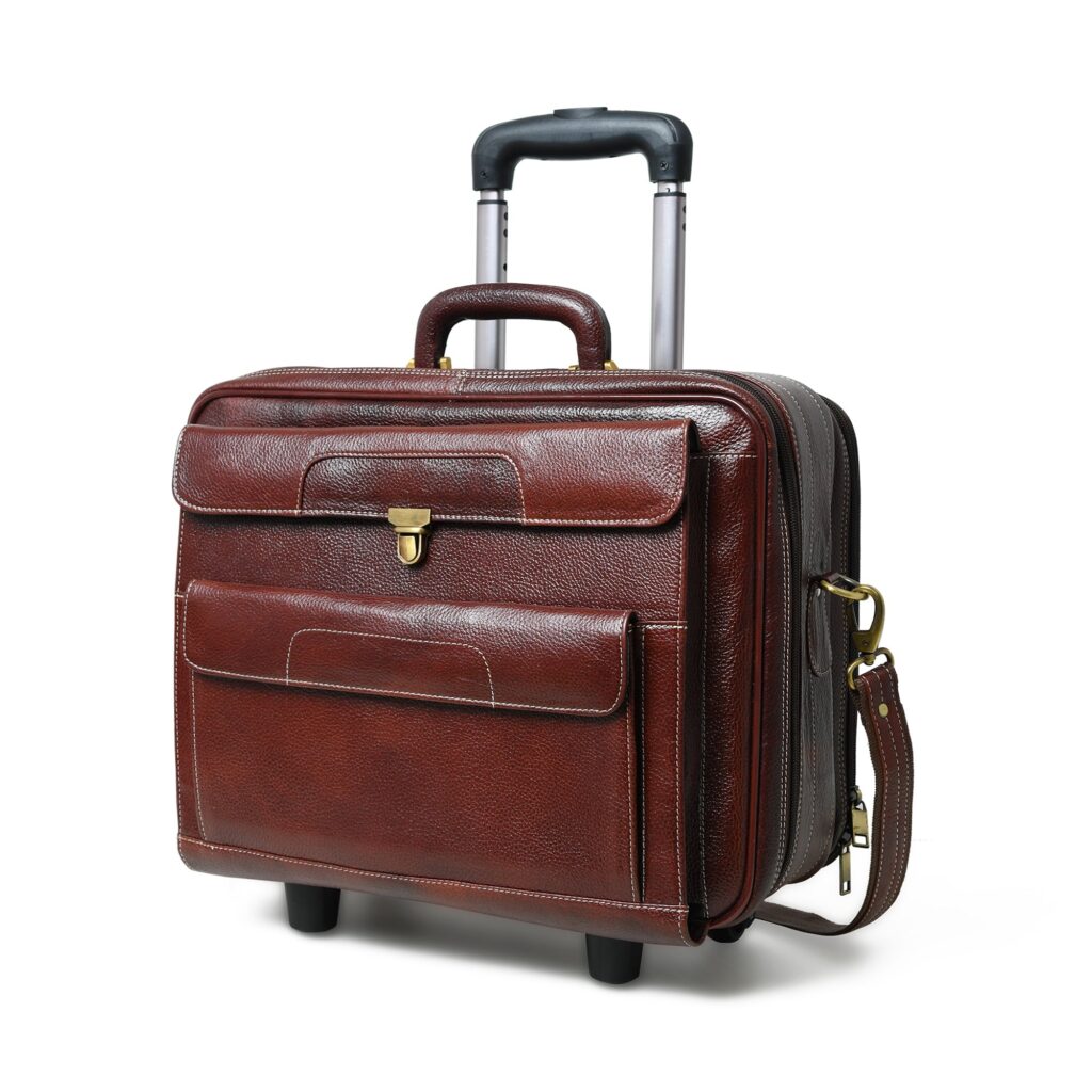 Brown leather wheeled carry-on case with a telescoping handle