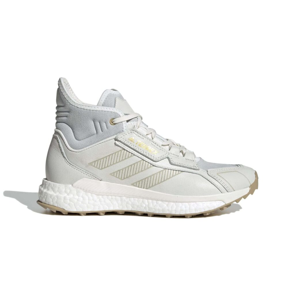 Light grey mid-top hiking shoe with a white cushioned sole, side view
